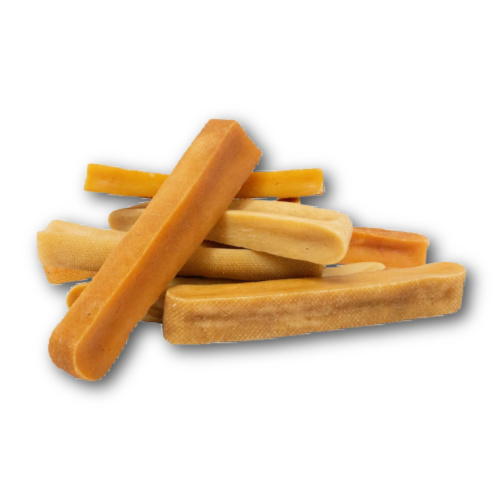 Large pile of large yak cheese chews on a white background