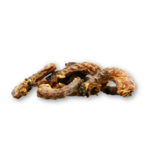 A pile of dried chicken necks for dogs on a white background