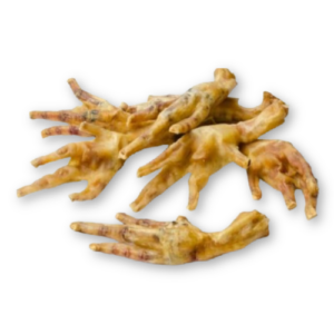 Pile of dehydrated chicken feet for dogs on a white background